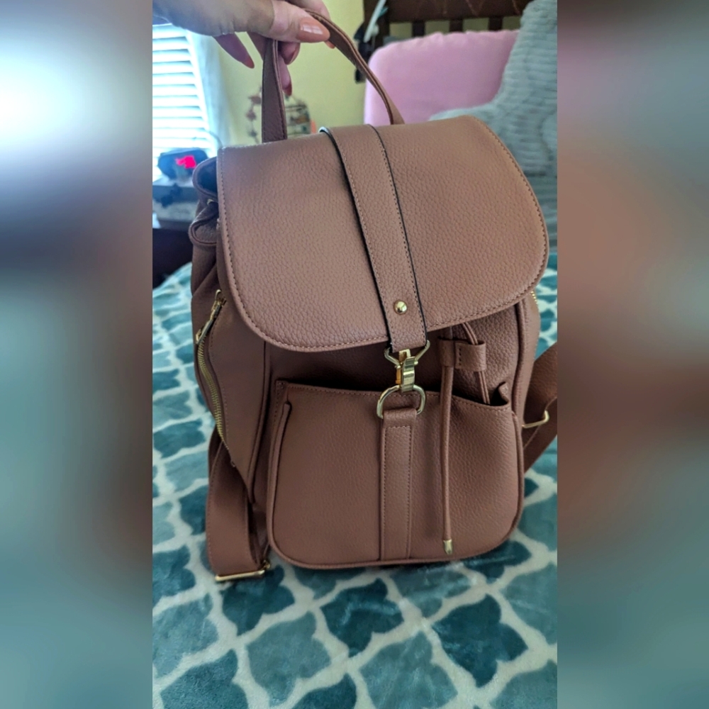 Cute pink backpack used once. Great condition. No tears, rips or stains